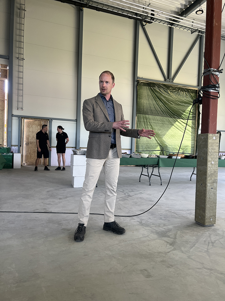man standing in a production hall