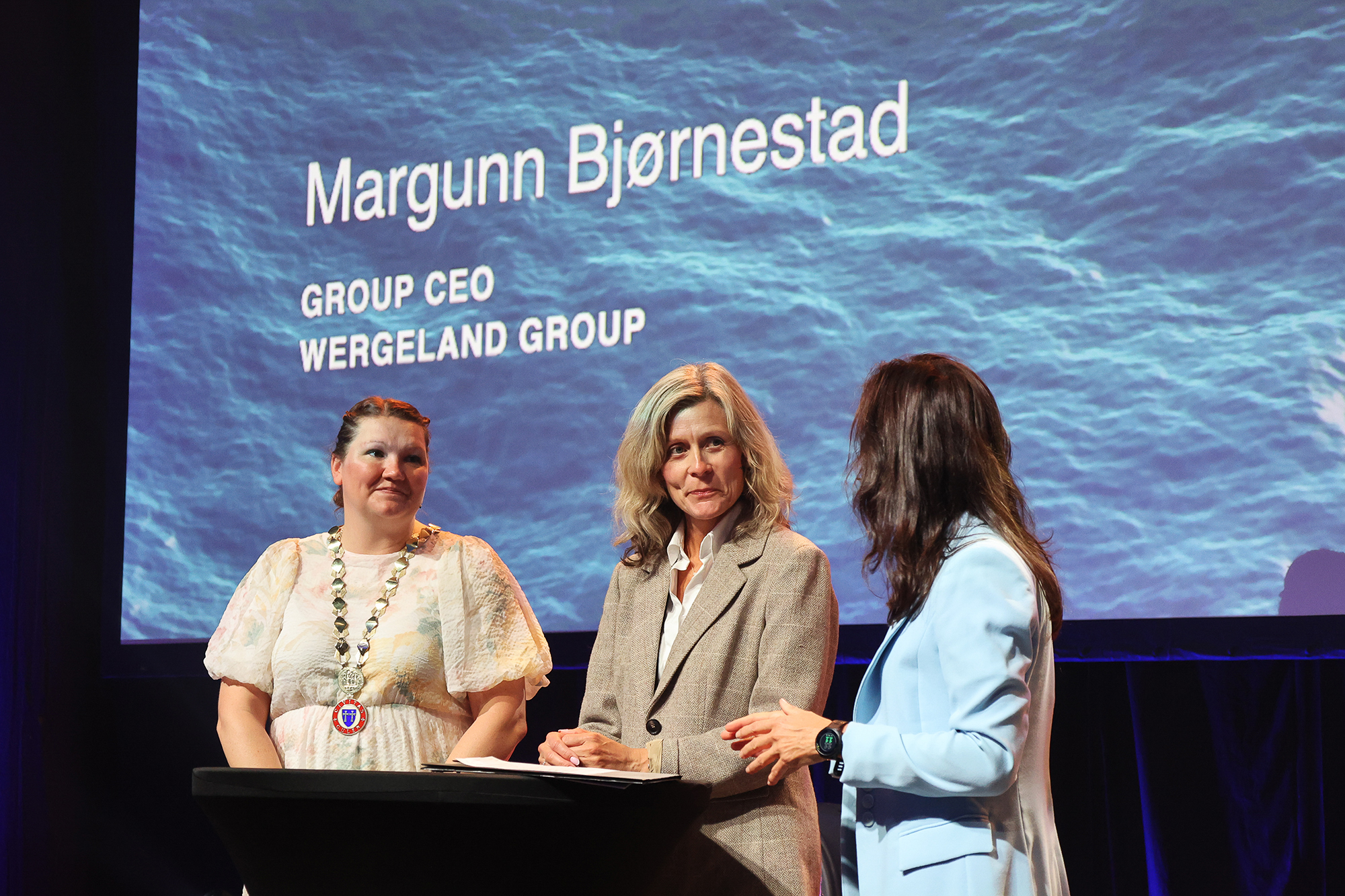 three women on stage