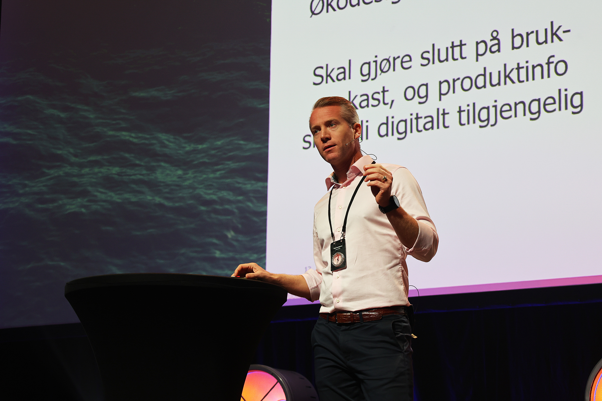 a man in front of a presentation