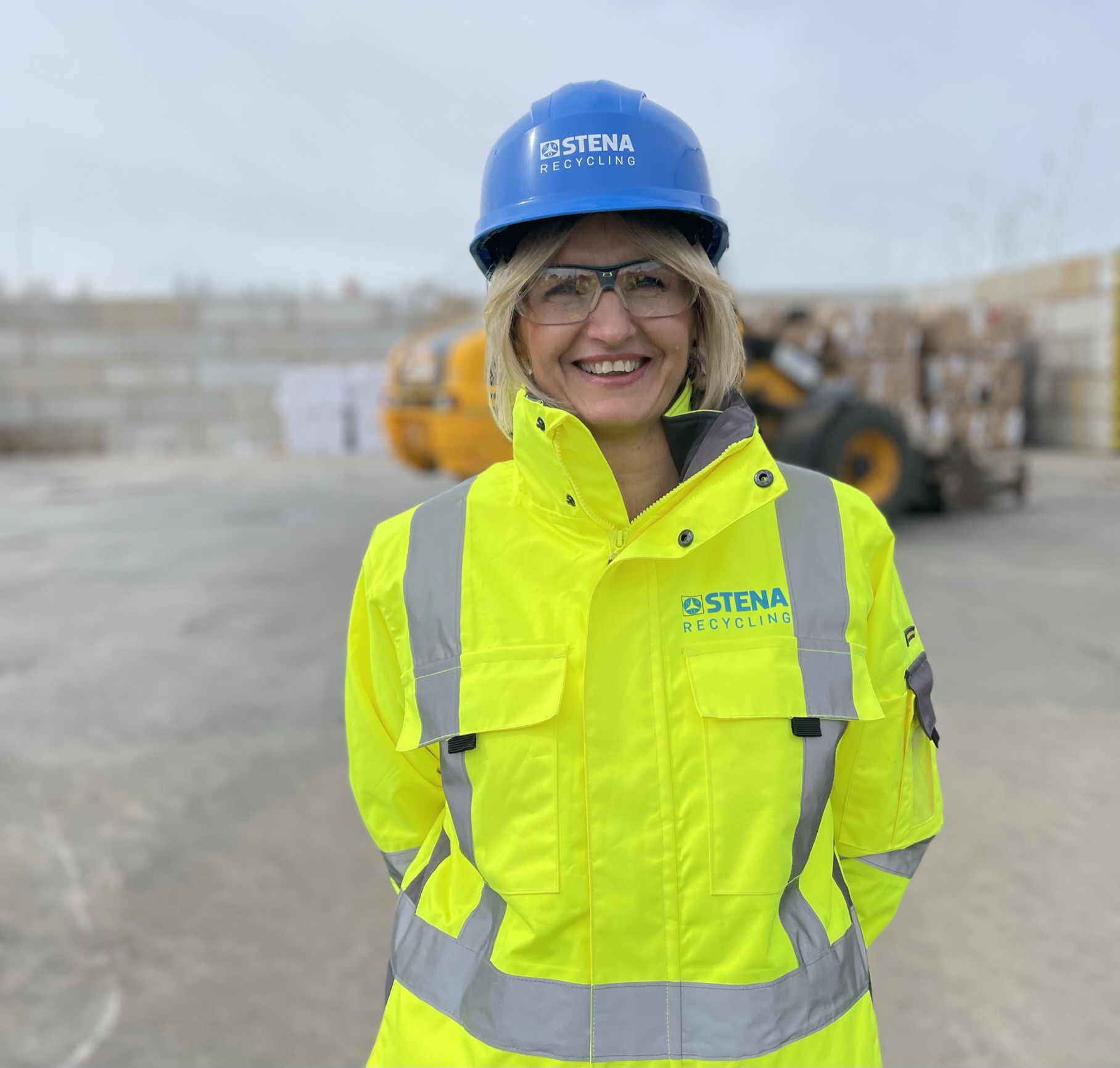 Iwona Korniluk, branch manager at a recycling facility, dressed in hi-vis protective gear, standing outside, talking about how they have managed to avoid accidents in 12 year.