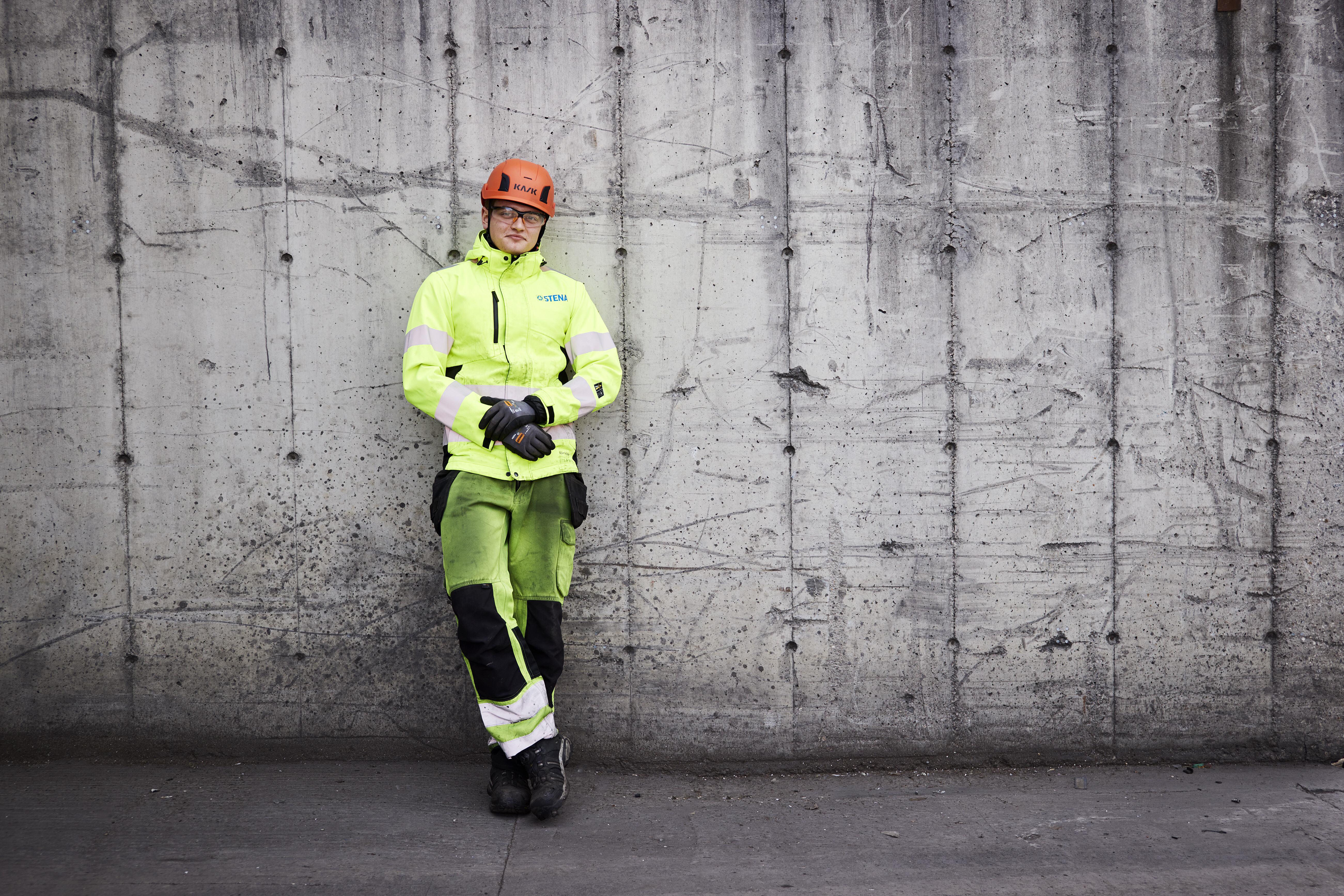 Man leaning against a wall