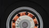 Close-up of an electric motor showing copper windings and other internal components against a black background.