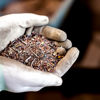 Hands holding shredded material