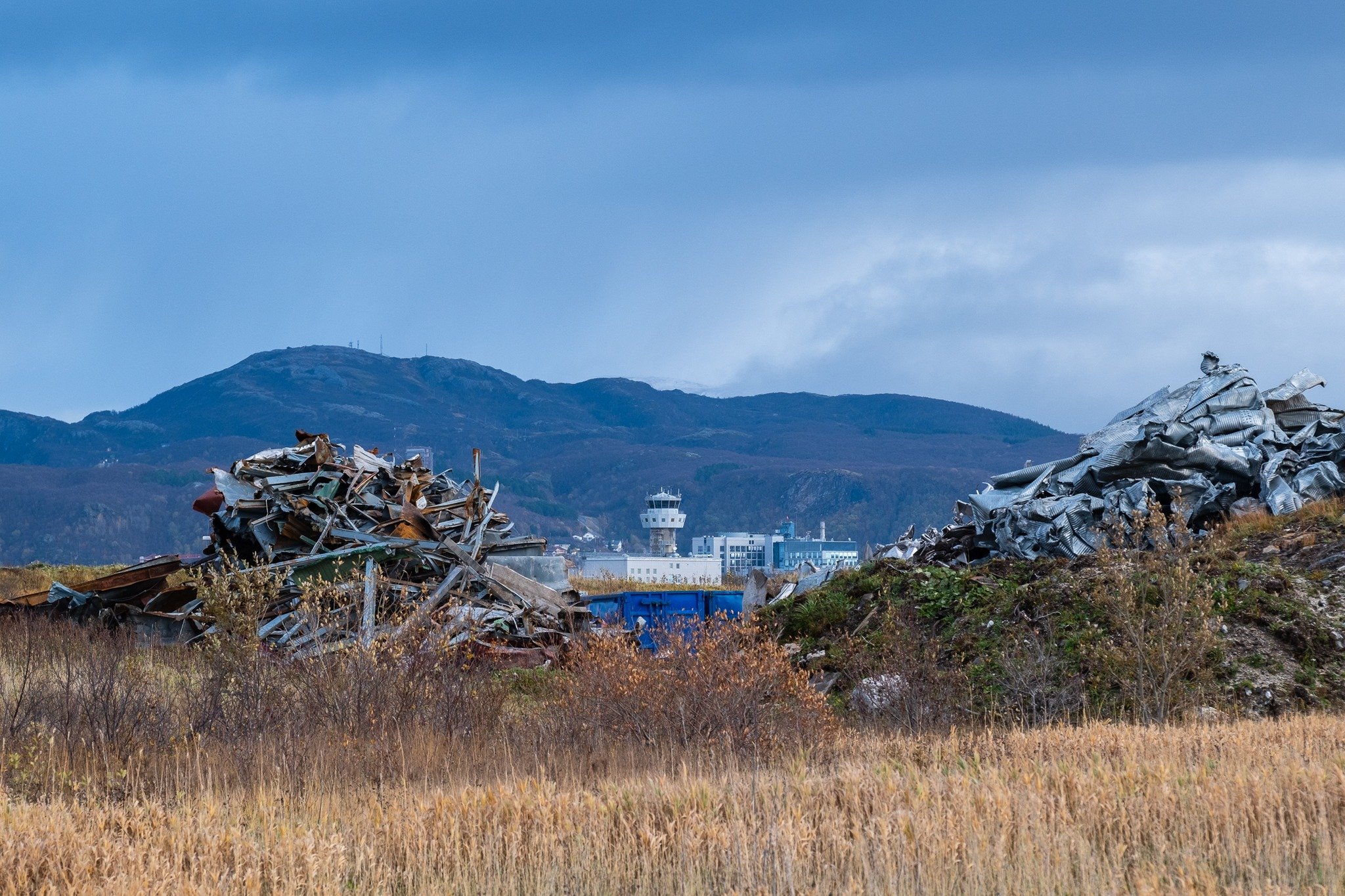 an airport tower and scrap metals