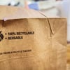 Paper bag with a recyclable icon