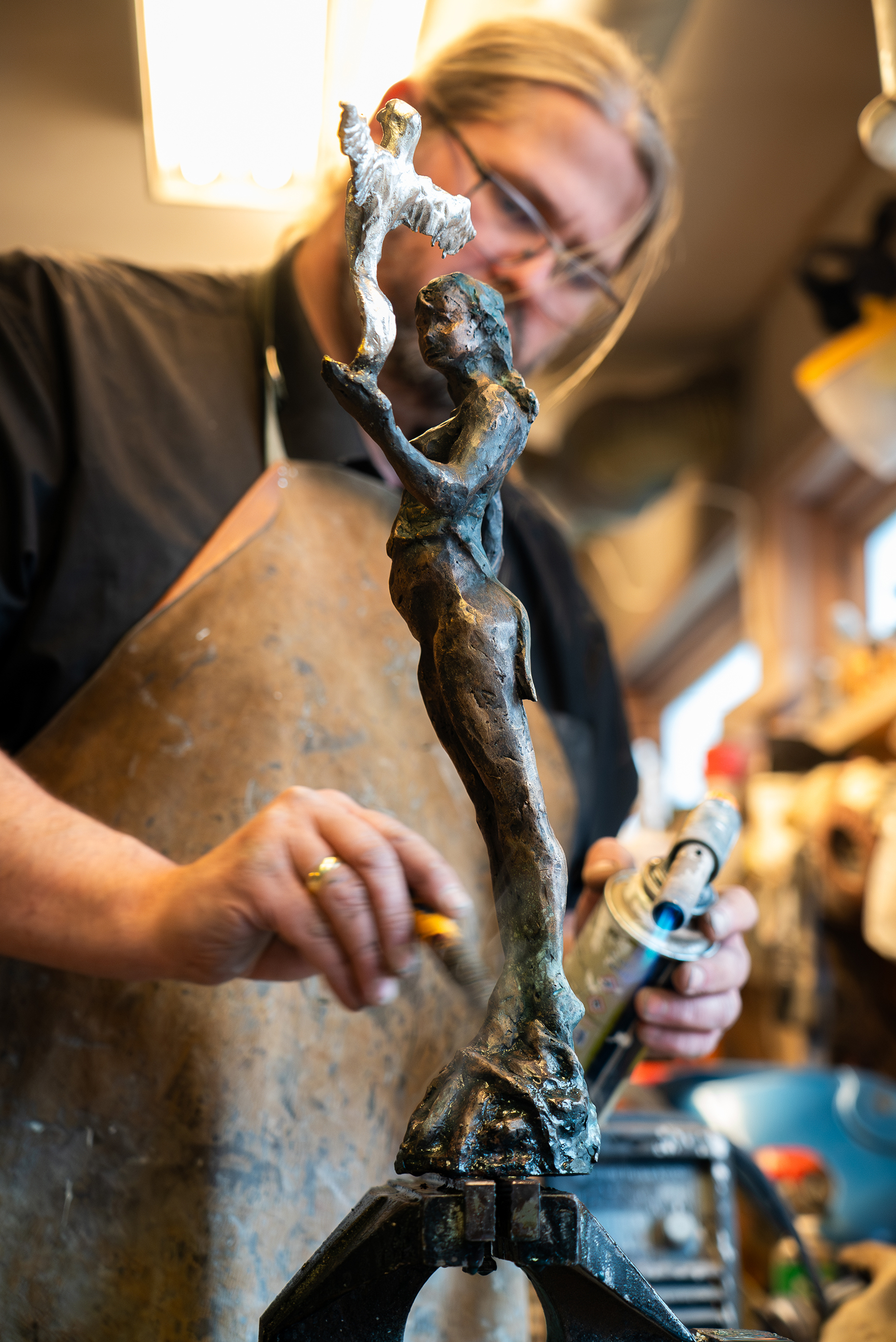 Artist with his sculpture