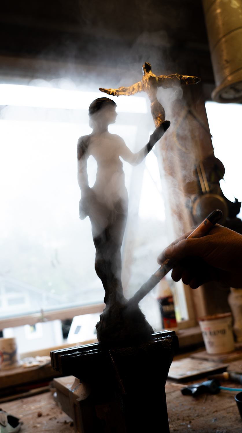 An artist working on a sculpture