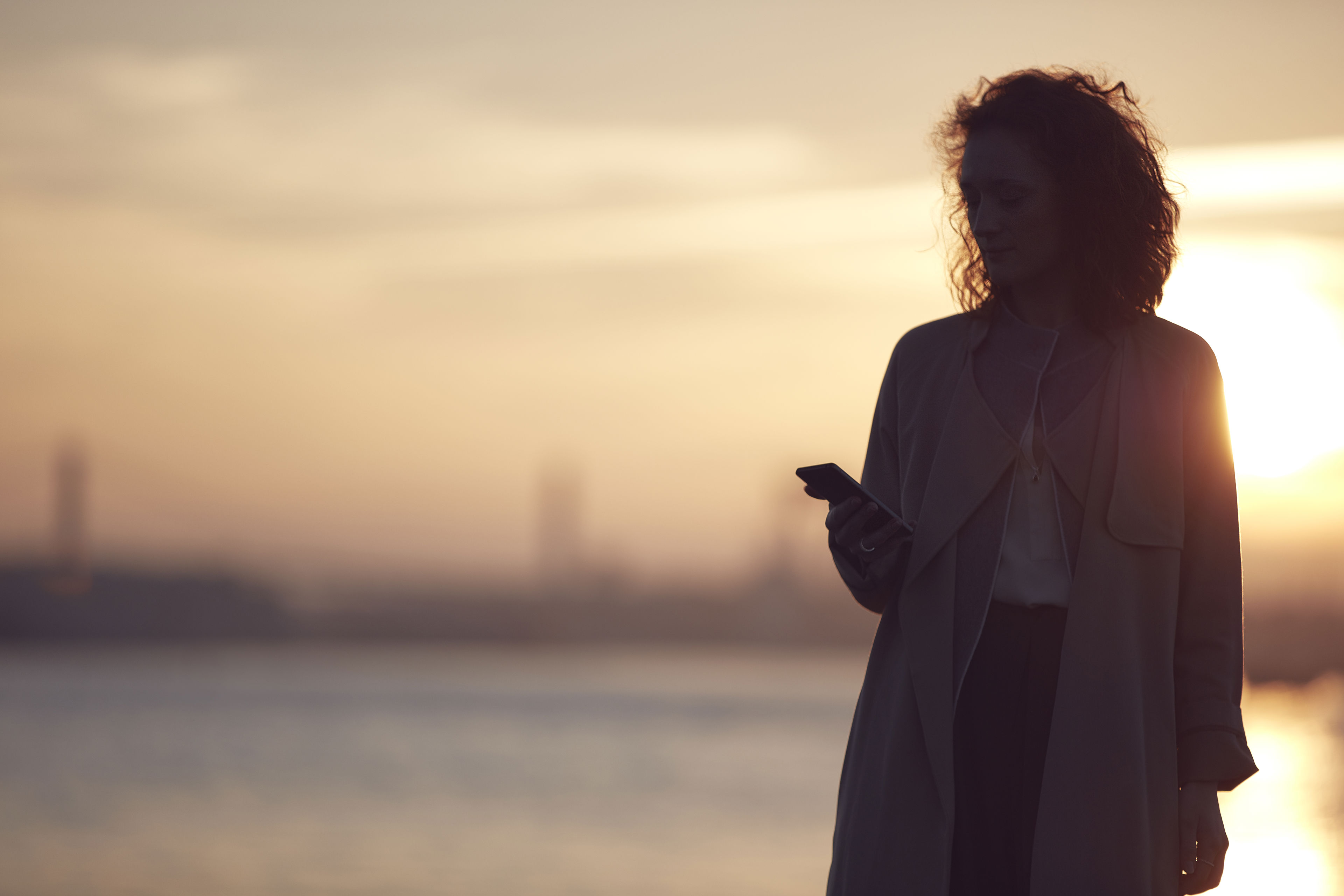 A woman infront of a sunset