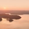 Sunrise over hills and lake