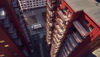 Bird’s eye view of a white Stena Recycling lorry collecting waste in a courtyard between tall residential buildings