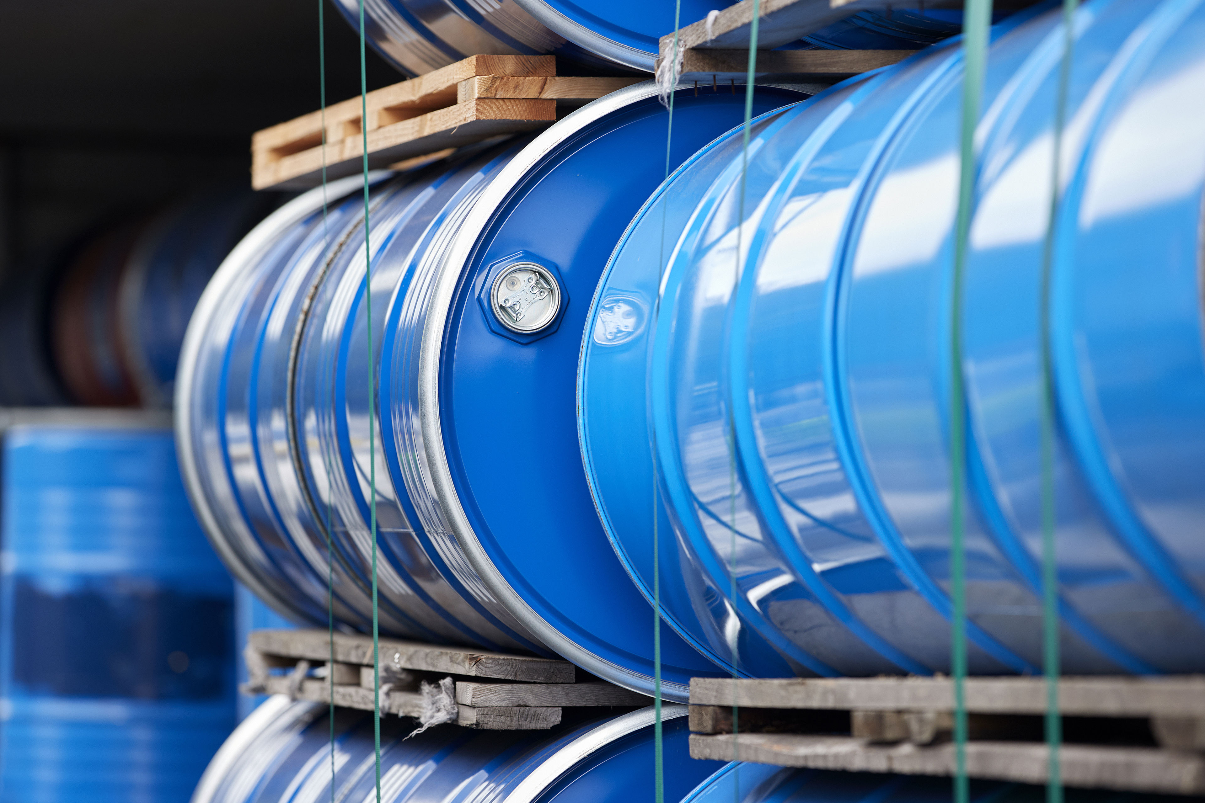 Two blue steel barrels containing hazardous waste for recycling