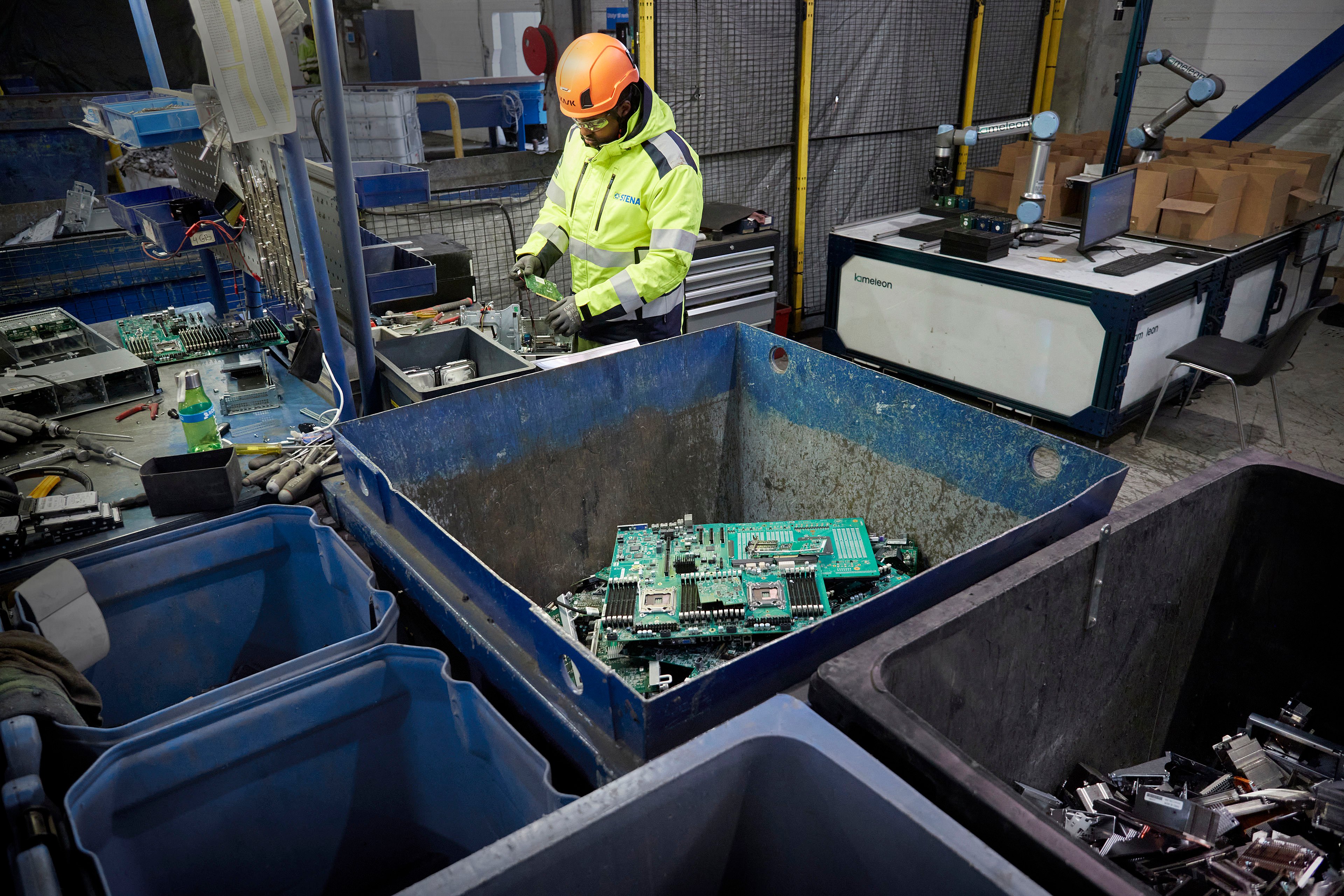 Used circuit boards safely stored in a container and ready to be recycled.