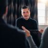 A Stena Recycling battery expert answers questions in an office environment.